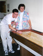 Sean Cryan plays a game with an elderly woman.